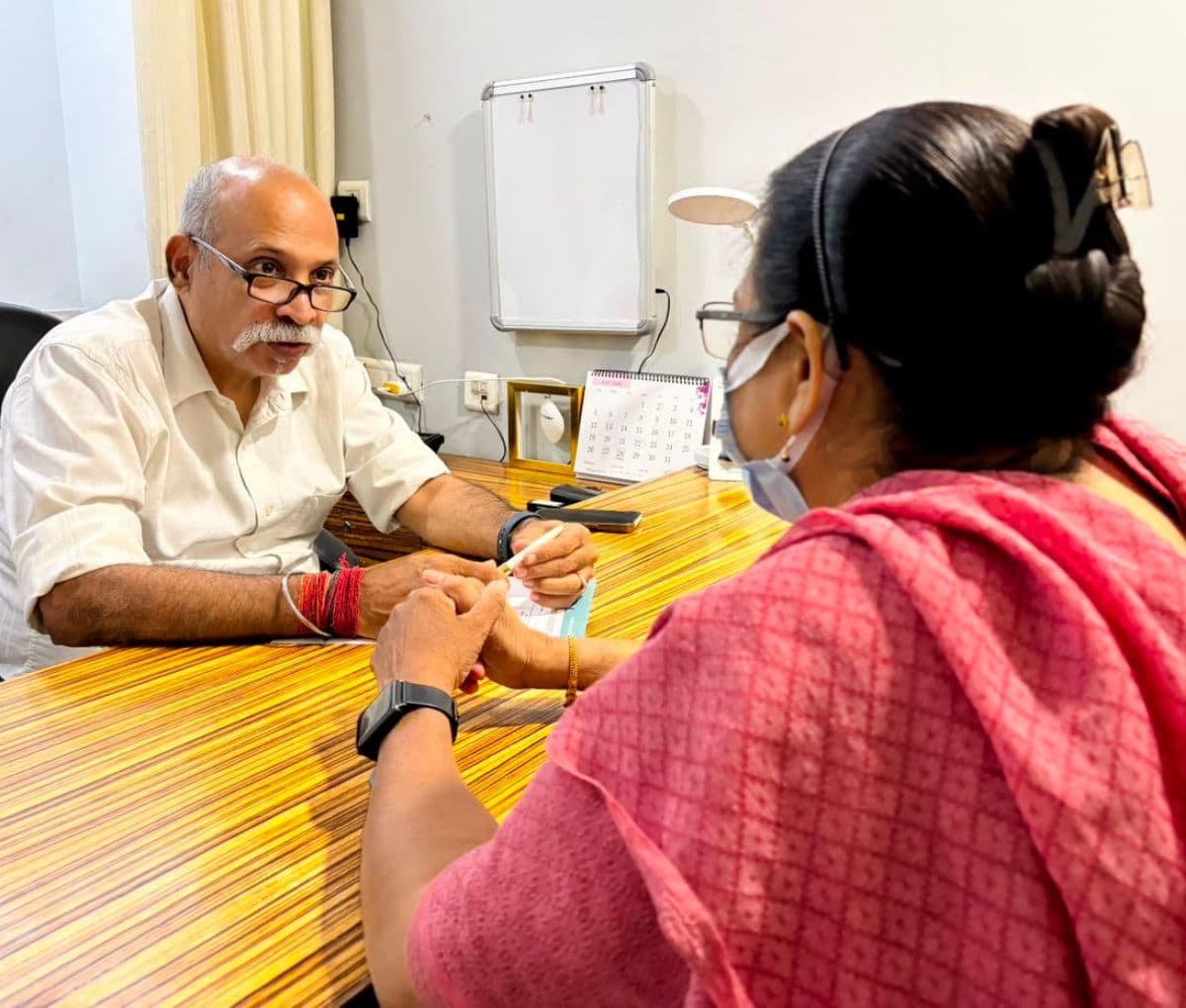 Dr. Naveen Saith, dermatologist, in consultation with a patient at Sama Hospital, South Delhi