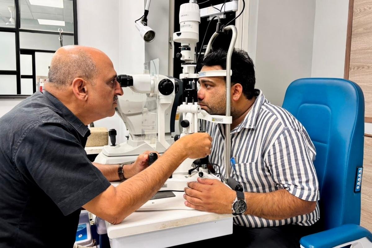 Dr. Sanjeev Gupta, ophthalmologist and vitreo-retina specialist, examining a patient at Sama Hospital, South Delhi